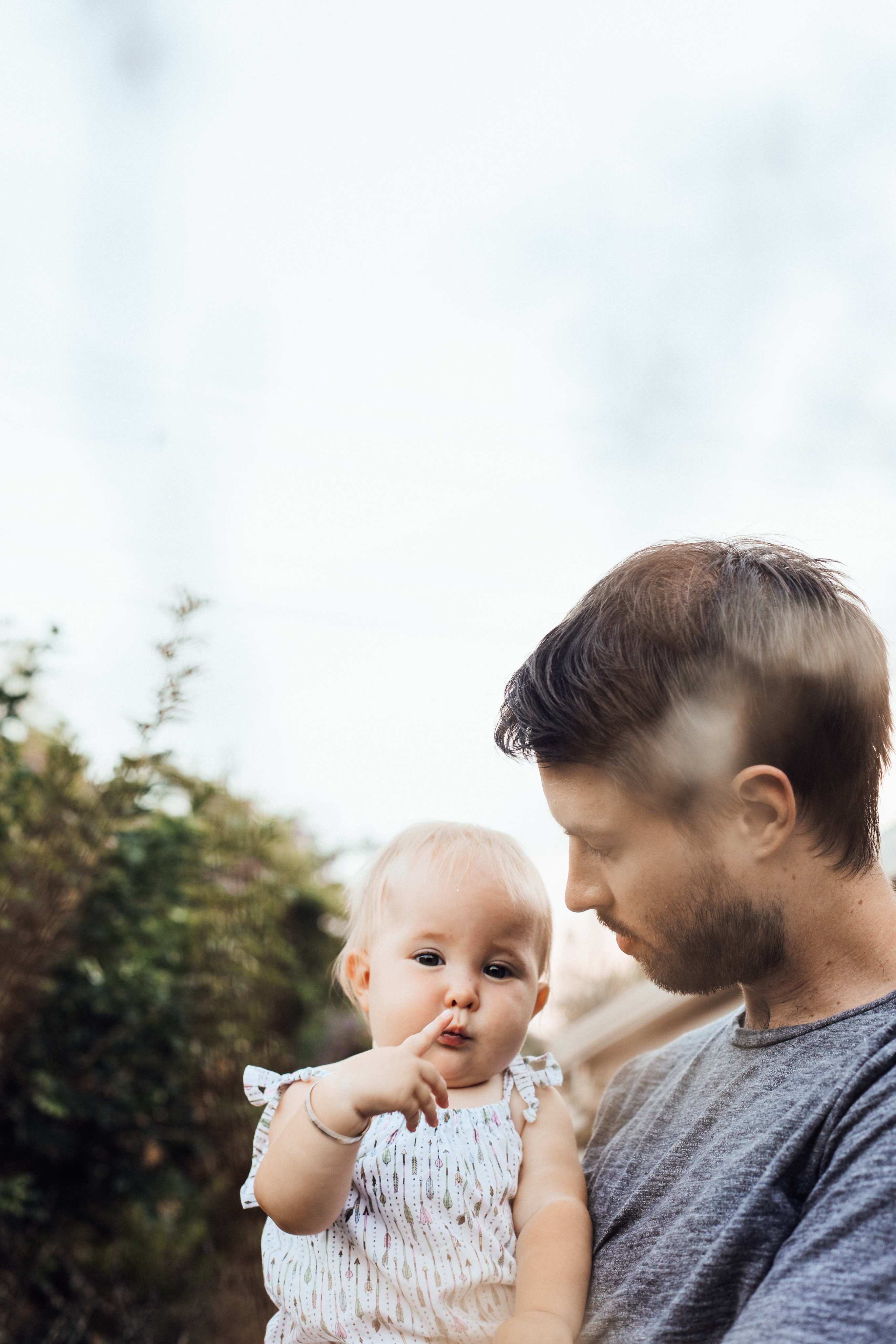 A father holding his young child